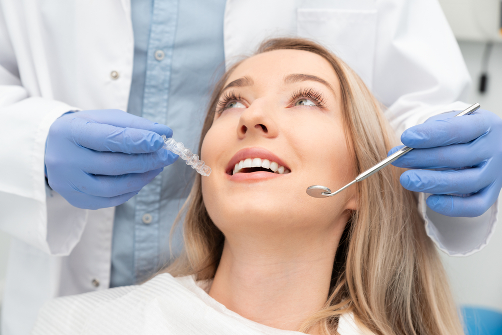 Happy Dental Patient in Modern Dental Office – melvin cohen dds