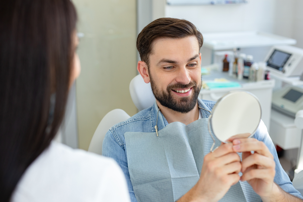 Happy Dental Patient in Modern Dental Office – melvin cohen dds